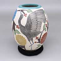 Polychrome jar with a lightly carved, sgraffito, and painted egret, branch, berry, flower, and geometric design
 by Melissa Tena of Mata Ortiz and Casas Grandes