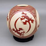 Red and white jar with a sgraffito four panel lizard and geometric design
 by Leonel Lopez Sr of Mata Ortiz and Casas Grandes