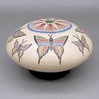 Polychrome jar with a sgraffito and painted butterfly and geometric design
 by Oscar Ramirez of Mata Ortiz and Casas Grandes