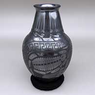 Black and gunmetal jar with a flared opening and a geometric design
 by Eduardo Ortiz aka Chevo of Mata Ortiz and Casas Grandes