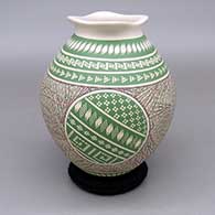 Polychrome jar with an organic flared opening and a fine line and geometric design
 by Elvira Bugarini of Mata Ortiz and Casas Grandes
