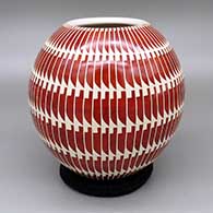 Red and white jar with a sgraffito fish and feather ring geometric design
 by Leonel Lopez Sr of Mata Ortiz and Casas Grandes