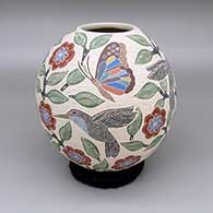 Polychrome jar with a sgraffito-and-painted butterfly, hummingbird, flower, leaf, and branch design
 by Sandra Lorena Arras of Mata Ortiz and Casas Grandes
