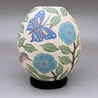 Polychrome jar with a sgraffito-and-painted butterfly, hummingbird, flower, leaf, and branch design
 by Sandra Lorena Arras of Mata Ortiz and Casas Grandes