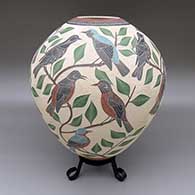 Polychrome jar with a sgraffito and painted bird, branch, leaf, and geometric design
 by Jesus Olivas of Mata Ortiz and Casas Grandes
