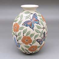 A polychrome jar with a rolled lip and decorated with a sgraffito-and-painted bird, butterfly, flower and branch design
 by Sandra Lorena Arras of Mata Ortiz and Casas Grandes