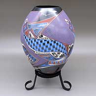 Polychrome jar with a colorful geometric design
 by Fabian Ortiz of Mata Ortiz and Casas Grandes