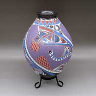 Large polychrome jar with a slightly flared opening and a colorful geometric design
 by Fabian Ortiz of Mata Ortiz and Casas Grandes