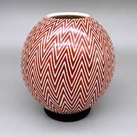 Red and white jar with a sgraffito fish and geometric design
 by Leonel Lopez Sr of Mata Ortiz and Casas Grandes