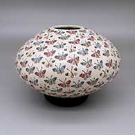 Polychrome jar with a sgraffito and painted butterfly design
 by Celia Lopez of Mata Ortiz and Casas Grandes