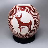 A red-on-white jar with a three-panel stag and geometric design
 by Leonel Lopez Sr of Mata Ortiz and Casas Grandes