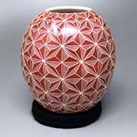 A red-on-white jar with a sgraffito geometric design
 by Leonel Lopez Jr of Mata Ortiz and Casas Grandes