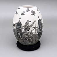 Black-on-white jar with a sgraffito Day of the Dead design
 by Hector Javier Martinez of Mata Ortiz and Casas Grandes