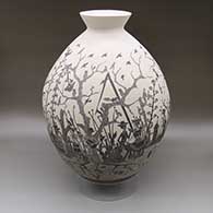 Large black-on-white jar with a flared opening and a sgraffito Day of the Dead design
 by Alfredo Rodriguez of Mata Ortiz and Casas Grandes