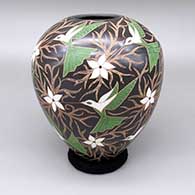 Polychrome jar with a sgraffito and painted hummingbird, flower, and branch design
 by Elicena Cota of Mata Ortiz and Casas Grandes