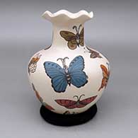Polychrome jar with a flared pie crust opening and a painted butterfly design
 by Olga Arras of Mata Ortiz and Casas Grandes