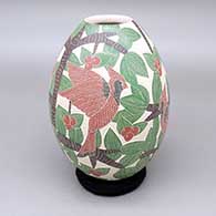 Polychrome jar with a sgraffito cardinal, berry, leaf, and branch design
 by Karla Flores of Mata Ortiz and Casas Grandes