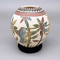 Polychrome jar with a sgraffito and painted hummingbird, flower, and geometric design
 by Saira Ledezma of Mata Ortiz and Casas Grandes