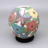 Polychrome jar with a sgraffito and painted hummingbird, butterfly, and flower design
 by Blanca Arras of Mata Ortiz and Casas Grandes