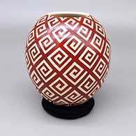 Red jar with a sgraffito geometric design
 by Leonel Lopez Jr of Mata Ortiz and Casas Grandes