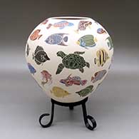 Polychrome jar with a sgraffito and painted tropical fish, sea turtle, eel, squid, jellyfish, and octopus design
 by Adrian Corona of Mata Ortiz and Casas Grandes