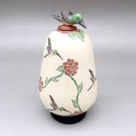 Polychrome lidded jar with a sgraffito and painted hummingbird and flower design and a matching lid with a hummingbird applique detail
 by Luz Elva Gutierrez of Mata Ortiz and Casas Grandes