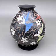 Polychrome jar with a flared opening and a sgraffito and painted hummingbird, flower, and branch design
 by Elicena Cota of Mata Ortiz and Casas Grandes