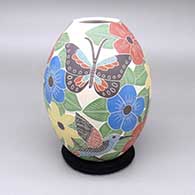 Polychrome jar with a sgraffito and painted hummingbird, butterfly, and flower design
 by Blanca Arras of Mata Ortiz and Casas Grandes