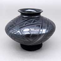 Small black-on-black jar with a flared opening and a five-panel geometric design
 by Virginia Baca of Mata Ortiz and Casas Grandes