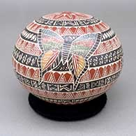 Polychrome jar with a sgraffito and painted butterfly and geometric design
 by Angela Corona of Mata Ortiz and Casas Grandes