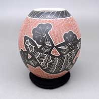A polychrome jar with a sgraffito lizard, spiral, and geometric design
 by Heri Mora of Mata Ortiz and Casas Grandes