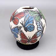 Polychrome jar with a sgraffito and painted butterfly design
 by Leticia Ledezma of Mata Ortiz and Casas Grandes