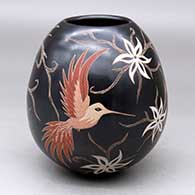 Click for a larger view A polychrome jar with a sgraffito and painted hummingbird, vine, flower and geometric design
by Elicena Cota of Mata Ortiz and Casas Grandes