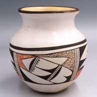 Polychrome jar with a short neck and rolled lip and a 4-panel bird element and geometric design below the shoulder
 by Pauline Setalla of Hopi