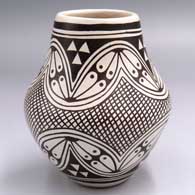 Black-and-white jar with a 4-panel geometric design
 by Helen Naha aka Feather Woman of Hopi