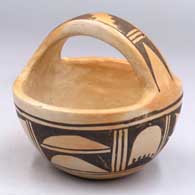 Small black-on-yellowware basket with a 6-panel geometric design and fire clouds
 by Unknown of Hopi