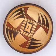 Polychrome yellowware bowl with a 4-panel bat wing and geometric design
 by Antoinette Honie of Hopi