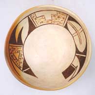 Black-on-yellowware bowl with a bird element and geometric design inside
 by Unknown of Hopi