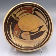 Polychrome yellowware bowl with a bird element and geometric design inside plus fire clouds
 by Unknown of Hopi