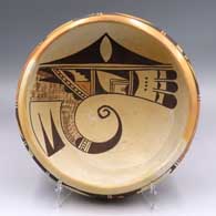 Polychrome yellowware bowl with a bird-hanging-from-sky-band design inside and a band of geometric design around the shoulder
 by Unknown of Hopi