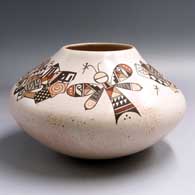 Polychrome jar with a raised rim and painted with a moth, dragonfly and geometric design above the shoulder
 by Rainy Naha of Hopi