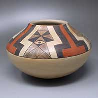 A polychrome jar with a four-panel geometric design above the shoulder
 by Dextra of Hopi
