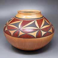 A polychrome jar with a recurved rim and an eight-panel geometric design above the shoulder
 by Dextra of Hopi