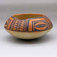 A polychrome jar with an unslipped base, a spout and a band of geometric design above the shoulder
 by Dextra of Hopi