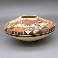 Polychrome jar with a painted parrot, dragonfly, and geometric design; piece was produced using coal-firing
 by Bobby Silas of Hopi