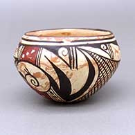 Small polychrome on marbleized clay bowl with a geometric design on inside and outside
 by Delaine Tootsie Chee of Hopi