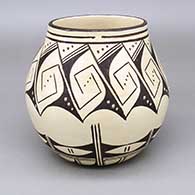 Black-on-white jar with a geometric design on inside and outside
 by Delaine Tootsie Chee of Hopi