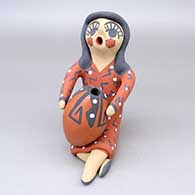 Polychrome seated woman with jar figure
 by Felicia Fragua of Jemez