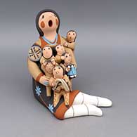 Polychrome storyteller with six children, plate, drum, and blanket
 by Diane Lucero of Jemez