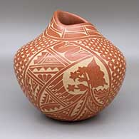 Red jar with organic opening and sgraffito butterfly, flower, feather, medallion, and geometric design
 by Carol Vigil of Jemez